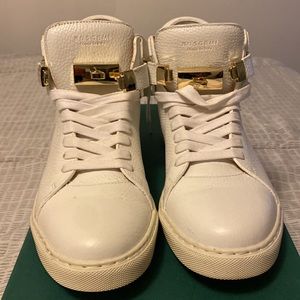 Buscemi 100MM size 42 (9) white w/gold clasp and padlock. Excellent condition.
